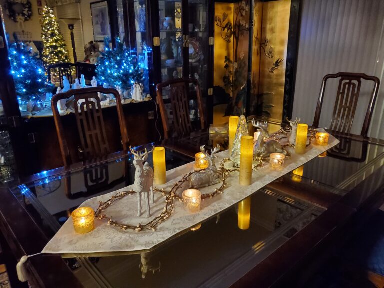 Table set with white tablecloth and candlelight