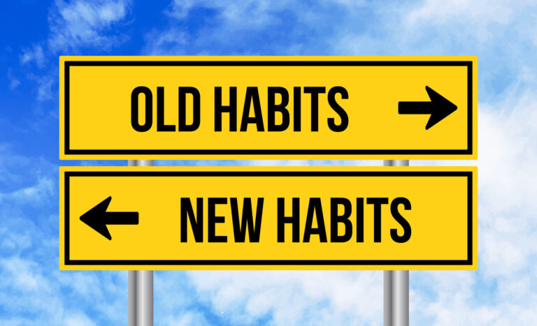 Old habits or new habits road sign on cloudy sky background